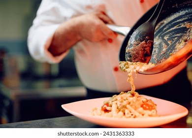 Close up of professional chef cooking int he kitchen. - Powered by Shutterstock