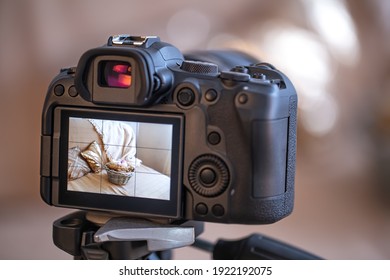 Close up professional digital camera on a blurred background. The concept of technology for working with photos and videos.