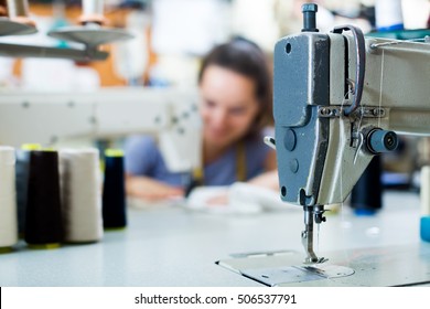 close up of professional sewing machine with needle and thread in sewing studio  