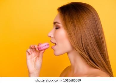 Close Up Profile Of Charming Woman Want To Bite Tasty Pink Macaron, Holding Macaroon Near Open Mouth, Beauty Fashion Girl Enjoying Food With Close Eyes, Dieting Concept, Junk Food, Weight Loss