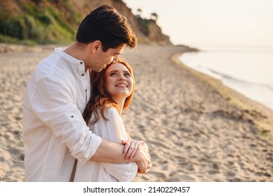 Close up profile happy smiling young couple two friends family man woman 20s wear white clothes hug rest relax together at sunrise over sea beach ocean outdoor seaside in summer day sunset evening. - Shutterstock ID 2140229457