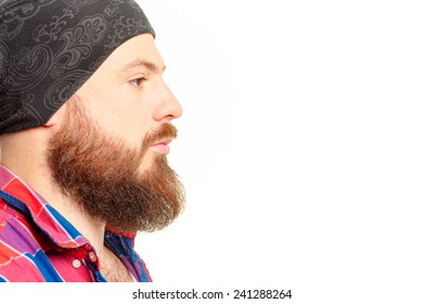 Close Up Profile Portrait Of Confident Young Bearded Man Looking Away Isolated On The White