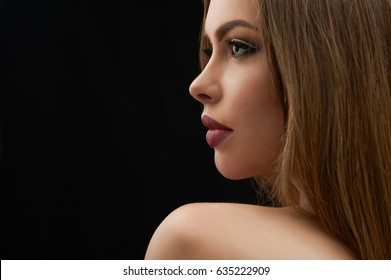 Close up profile shot of a gorgeous sexy young female model with perfect sensual lips and blue eyes copyspace on the side perfection beauty skin face lip augmentation femininity glamorous elegance.