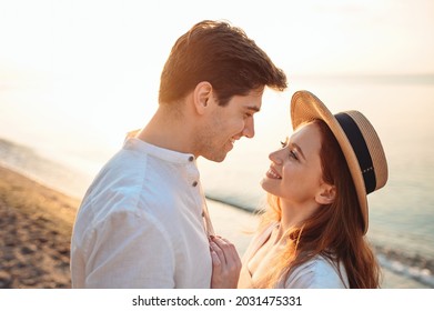 Close up profile young happy sunlit couple two friends family man woman in white clothes hug going to kiss together at sunrise over sea beach ocean outdoor exotic seaside in summer day sunset evening - Shutterstock ID 2031475331