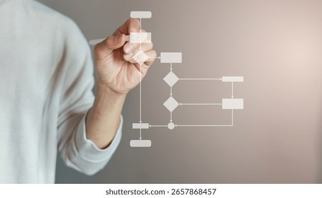 close up programmer engineer hand use stylus pen to write and plan about progress or procedure of strategy and resolve with virtual flowchart diagram for business plan and performance concept
