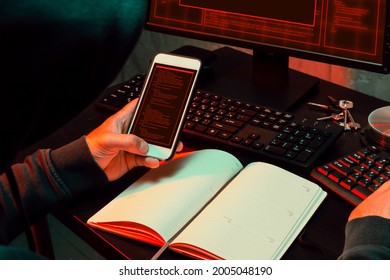 Close up of programmer of hacker hands typing a code