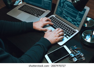 Close up of programmer of hacker hands typing a code