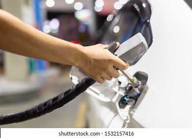 Close Up Of Pump Nozzle Compressed Natural Gas (cng) In Tank For Car. 