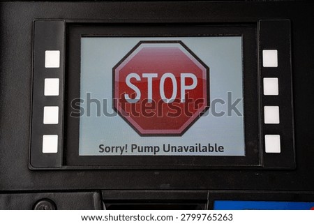 Close up of pump unavailable warning on fuel dispenser screen.