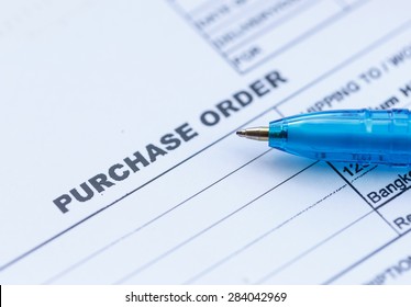 Close up purchase order with blue pen in the office
