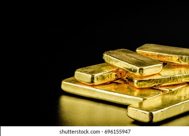 Close Up Pure Gold Bar Ingot Put On The Black Color Leather Surface Background Represent The Business And Finance Concept Idea