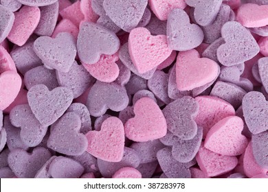 Close Up Of Purple Ad Pink Candy Hearts