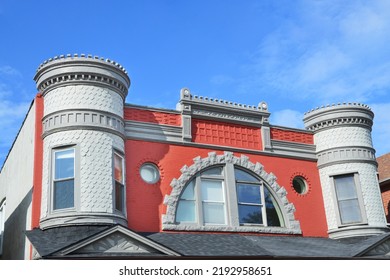 Close Up Of Queen Anne Victorian Style Home Turrets And Arch Window On Blue Sky Day With Clouds In Midwest USA