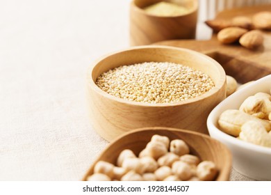 Close up of quinoa seeds in a bowl among other alternative natural plant protein source for Vegan. Health benefits, Heart-healthy fats, Brain, Bone, Immunity, Superfoods, antioxidants, nutritious.
