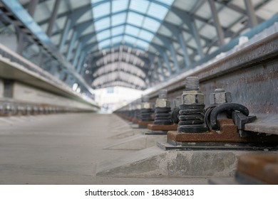 Close Up Rail Fastener For Hold Rail With Concrete Slab Track Of Sky Train. Selective Focus.