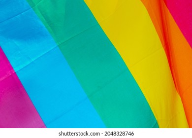 Close up rainbow flag, A symbol of lesbian, gay, bisexual, transgender, and queer (LGBTQ) pride and LGBT social movements, Six stripes of colourful colour, Wrinkles of fabric texture background. - Powered by Shutterstock