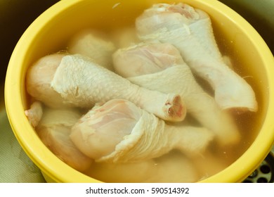 Close Up Raw Chicken Meat Drumstick In Water, Washing Cleaning And Food Preparing.