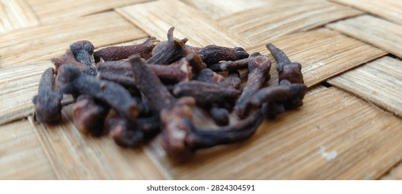 Close up of raw clove spice showcasing its unique shape and rich earthy flavor profile for recipes