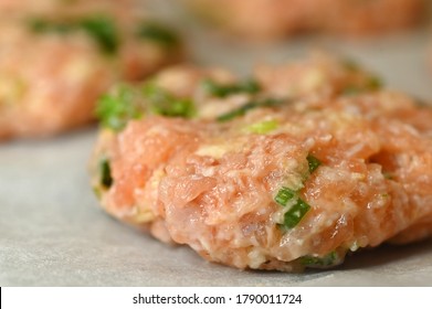 Close Up Of Raw Fish Cakes On A Baking Paper. No People. Copy Space