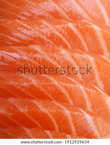 close up raw salmon fillet slices texture