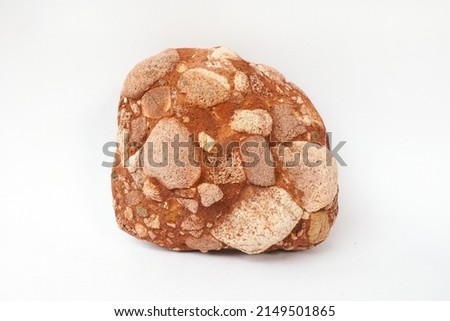 Close up raw specimen red conglomerate rock isolated on white background.
