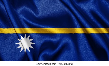 Close up realistic texture fabric textile silk satin flag of Nauru waving fluttering background. National symbol of the country. 31st of January, Happy Day concept
