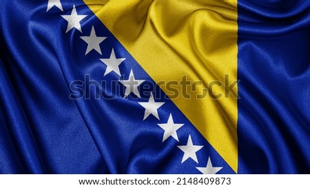 Close up realistic texture fabric textile silk satin flag of Bosnia and Herzegovina waving fluttering background. National symbol of the country. 1st of March, Happy Day concept
