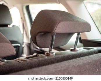 close up of rear auto adjustable head restraint fitted into the top of the rear seats - Shutterstock ID 2150850149