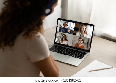 Close Up Rear View Of Woman Look At Laptop Screen Talk Speak On Video Call With Diverse Girlfriends At Home. Female Have Webcam Digital Virtual Conference With Friends. Online Communication Concept.