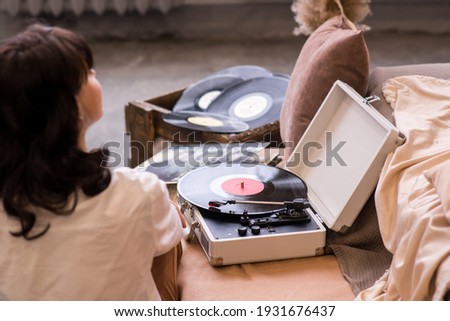 Close up of a record player playing vinyl. Retro Vinyl Turntable Stylus