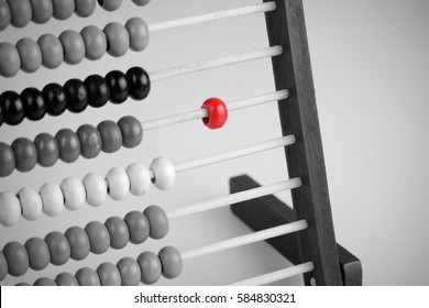 Close up Red abacus art concept, traditional abacus in front of black and white tone background, vignette effect design. Selective focus and copy space.