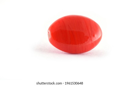 Close up of red Beads on the white background.Oval shape beads, Background or texture of beads. macro,used in finishing fashion clothes. make bead necklace or string of beads for woman of fashion.