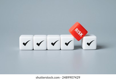 close up at the red cube  to identify red danger risk cube among other normal incident. Risk management concept for business and personal planning for risk mitigation.