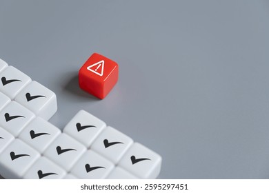 close up at the red cube to identify red danger risk cube among other normal incident. Risk management concept for business and personal planning for risk mitigation.