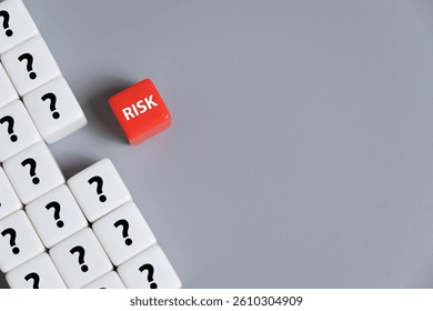 close up at the red cube to identify red danger risk cube among other normal incident. Risk management concept for business and personal planning for risk mitigation