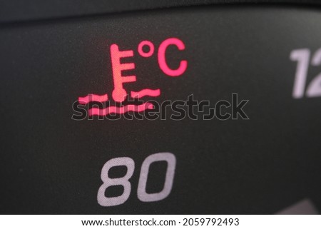 Close up of a red heat gauge icon