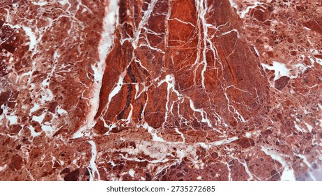 Close up of red marble with white patterns found in nature