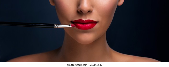 Close Up Of Red Mat Lips With Cosmetic Brush. Professional Makeup. Banner.