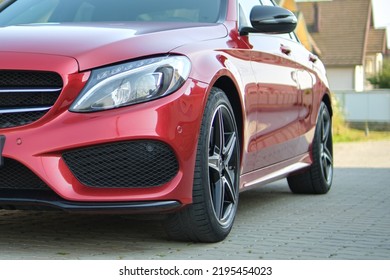 Close Up Of Red Mercedes C 220 D Car Parked On Suburban Street Side. Urban Traffic Concept. Kyiv, Ukraine - July 5, 2021.