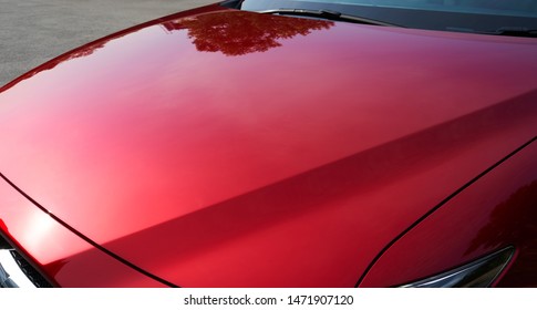 Close up of red metallic paint coating car body