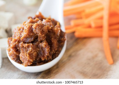 Close Up Of Red Miso Paste In A Chinese Soup Spoon.