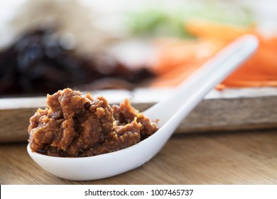 Close Up Of Red Miso Paste In A Chinese Soup Spoon.