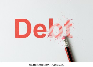 Close Up Of Red Pencil Erasing The Word Debt On Paper