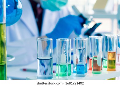 Close up of Red, pink, green, orange blue color liquid medicine in Test tube in rack on chemical table in the modern laboratory room. The education Chemistry and medical science research concept. - Shutterstock ID 1681921402