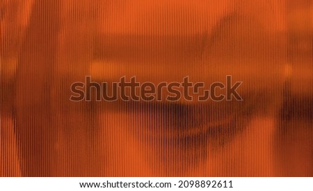 close up red polycarbonate sheet wall with lighting for interior partition. orange frosty glass polycarbonate sheet texture. transparent material named corrugated glass surface.