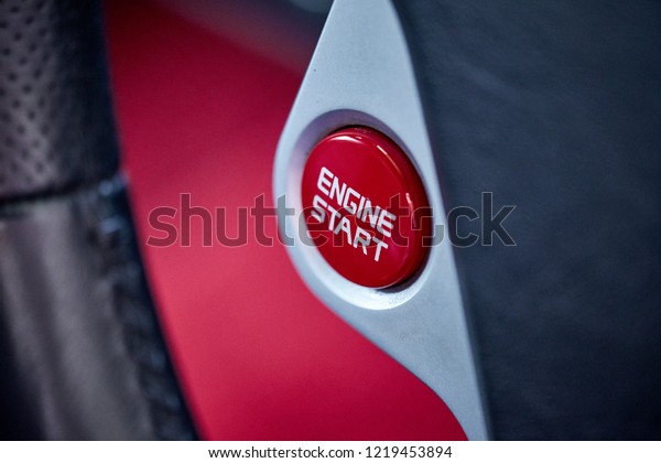 Close up\
of red push start button background. Modern luxury supercar engine\
start stop button switch. Keyless car engine ignition system.\
Concept of self motivation\
background.