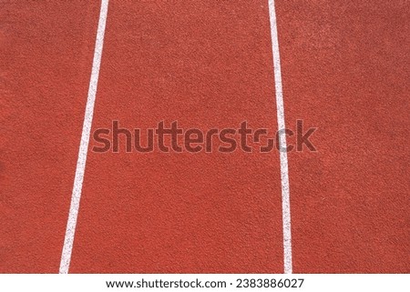 close up red running track, sports court or playground background with white line.