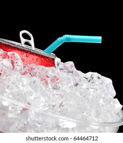 Close Up Of A Red Soda Can In A Bucket Of Ice With A Blue Straw. Black Background With Shallow Depth Of Field Focus Is On Can And Straw.