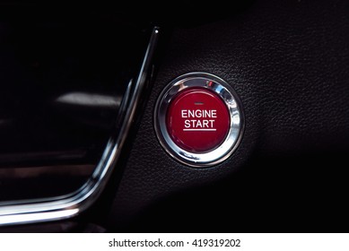 Close Up Of Red Start Engine Button On Black Car Console.