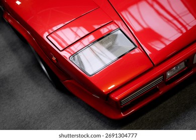 a close up of a red supercar 